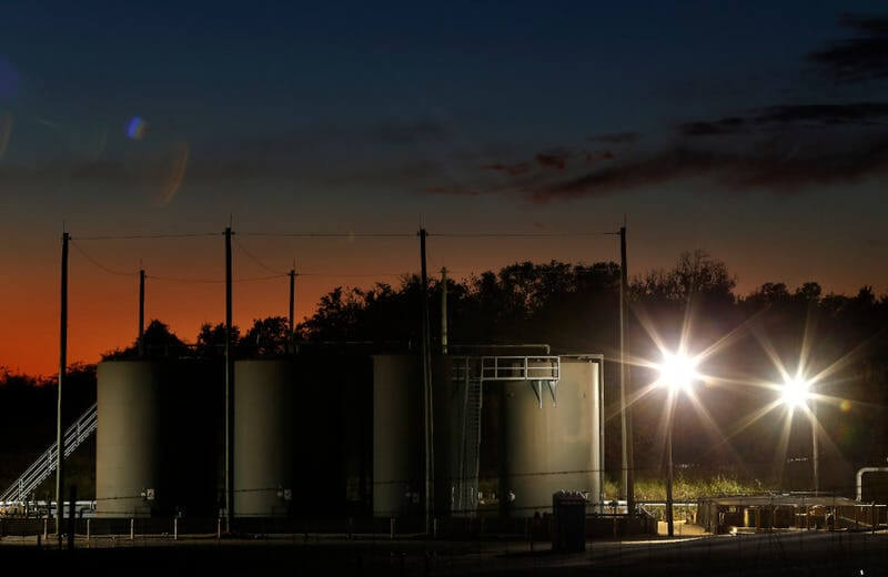 The sun sets behind a wastewater disposal well just outside the city limits of Reno, Texas. In 2015, scientists tied earthquakes in Reno and neighboring Azle to the disposal of wastewater from oil and gas production. (File Photo/Staff Photographer)